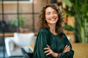 smiling young businesswoman standing in office