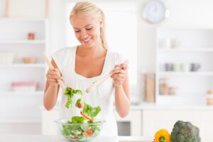 woman mixing a salad