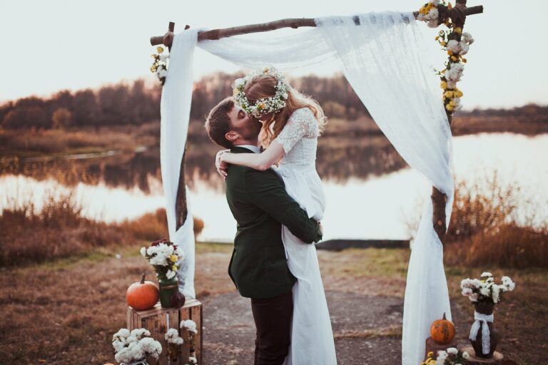 a couple kissing on their wedding day