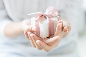 small gift in the hands of woman