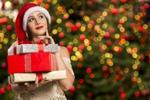 woman holding Christmas gifts