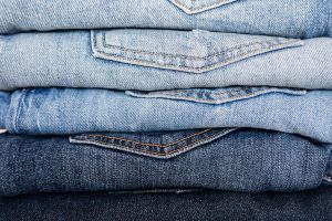 Stack of neatly arranged blue jeans
